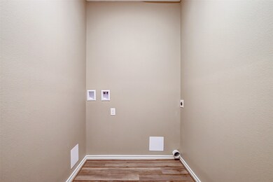 Laundry is a breeze with the utility room conveniently located near the kitchen. Washer and dryer included.