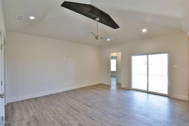 Spare room featuring light hardwood / wood-style f