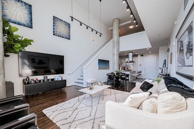 View from the living room to the entryway, kitchen
