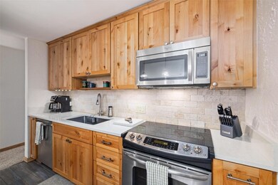 Fully stocked kitchen featuring stainless steel ap