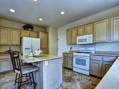 Kitchen. Kitchen with center Bar and Ample Cabinets.