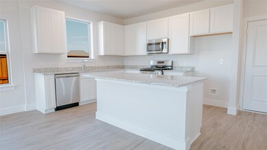 Kitchen with appliances with stainless steel finis