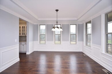 Dining Room.  Photos are from a different Community Model but Similar Floor-plan.