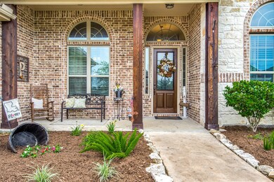 Beautiful front porch with 3 large wood post and w