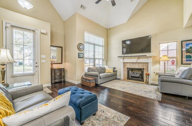 Living room with dark hardwood / wood-style floori