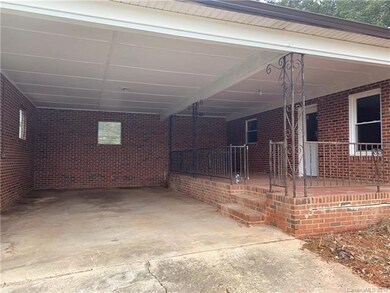 Fully covered carport and large patio, perfect for entertaining family or friends