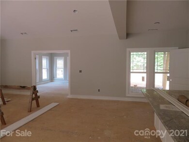 In the doorway is the start of the large sunroom