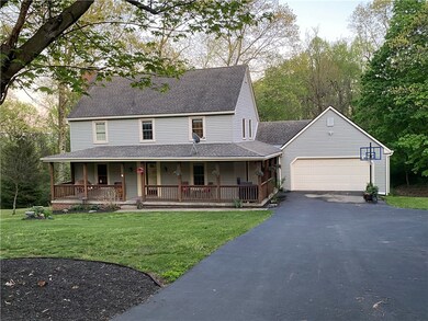 Two car attached garage, ample parking and gorgeous wrap around front porch