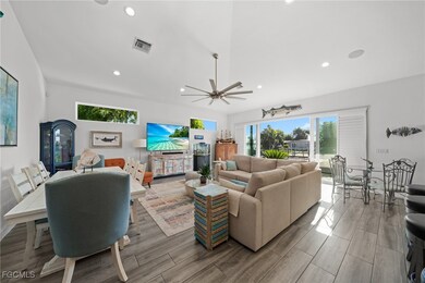 Living room featuring recessed lighting, plenty of natural light, ceiling fan, and light wood finished floors