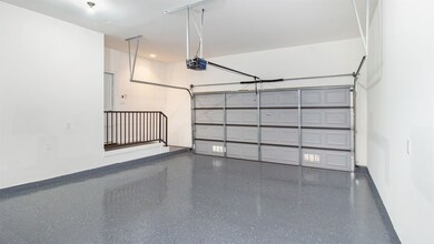 Freshly applied epoxy in the garage plus freshly p