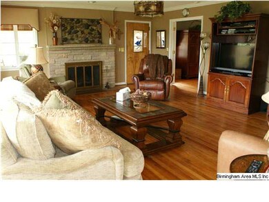 The greatroom opens onto the screened porch and ha