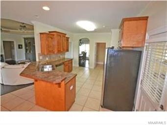 Large kitchen with stainless/black appliances