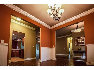 Dining Room. Formal dining room off kitchen with crown molding.