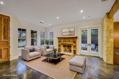 Living area with recessed lighting, visible vents
