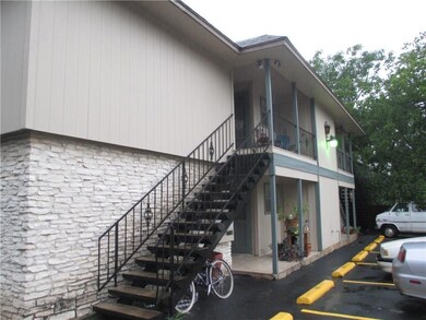 View of side of property with stone siding, stair