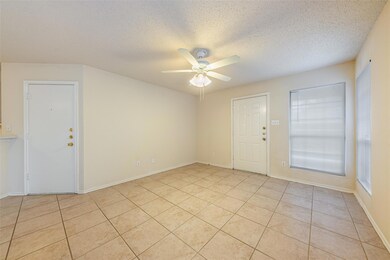 Spare room with light tile patterned flooring, a 