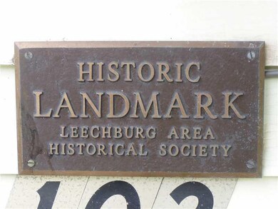 Exterior Front. Historic Plaque on the front of th