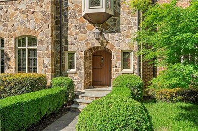 View of exterior entry with stone siding