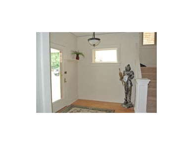 Entryway.  Convenient hooks and shelf for hanging 