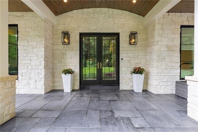 Property entrance with french doors