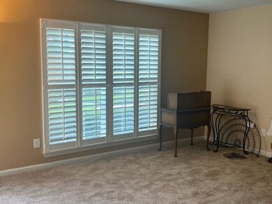 Plantation shutters create a luxe living room.