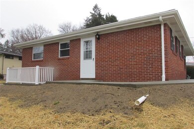 Side view- new sidewalks and outdoor access to low