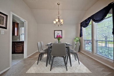 High Arched Doorway lead you into your Wonderful Casual Dining Area with High Vaulted Ceilings! Direct entry into your Gourmet Kitchen making serving a snap!