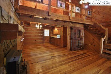 Living room view looking up to loft - notice stain