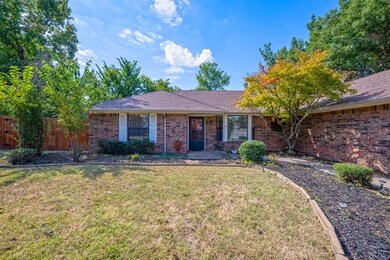 Ranch-style home featuring a front yard