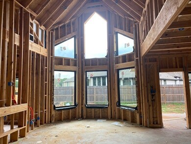 Full wall of windows on the rear of the family room.