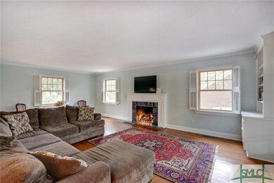 Large family room with hardwood floors, marble fac