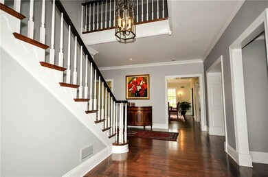 The spacious  2 story open entry features gleaming