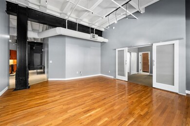 This spacious loft features high ceilings, exposed