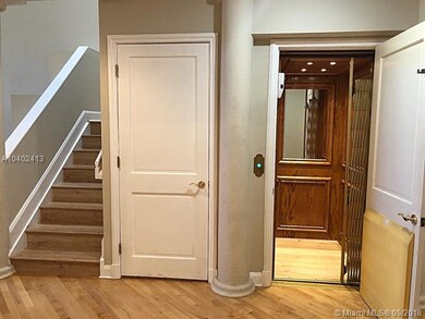 new wood floors on stairs, elevator and  2nd level