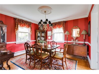 The gracious dining room also features lovely millwork.