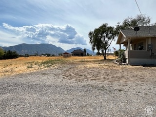 View of yard featuring a mountain view and a view of countryside