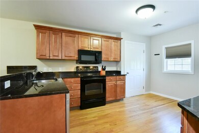 Kitchen showing entry door.