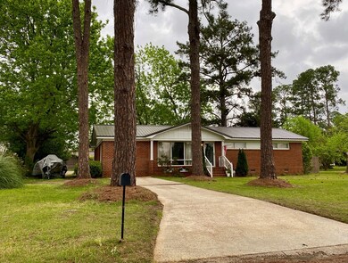 Paved parking at front of home