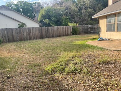 View of fenced backyard