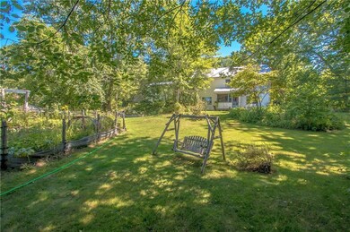 Back yard has natural shade and a...