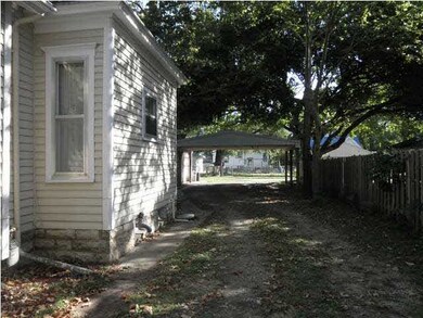 Driveway on West side of home to 2-car carport.