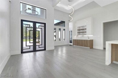 Front entry featuring impact glass entry doors, up