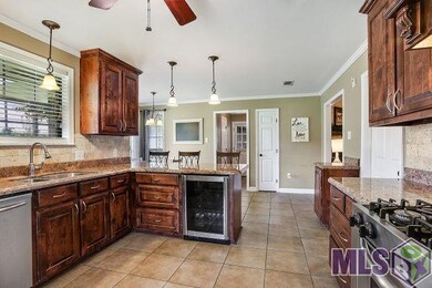 Slab granite, gas range, & built-in wine cooler