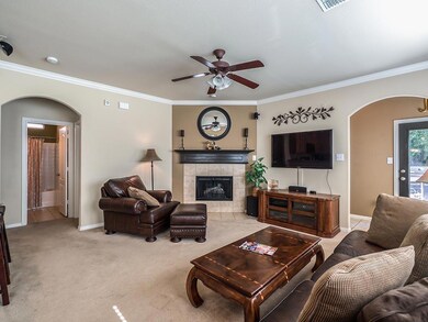 Gas fireplace & logs are the focal point in this o