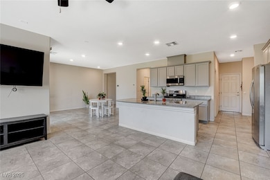 Kitchen with appliances with stainless steel finis