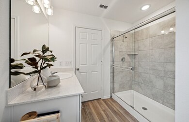 Deep walk in shower in owner's suite *Model representation
