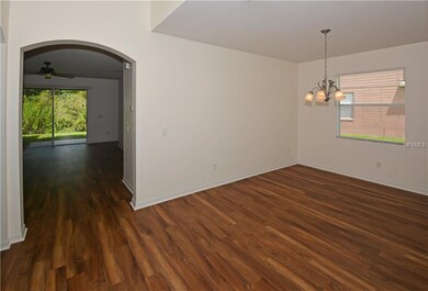 Dining Room with Family Room beyond through the Ar
