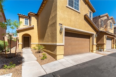 View of front facade featuring stucco siding, an a