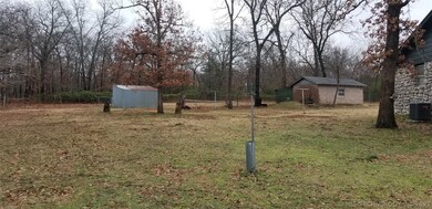 Storage building and storm cellar located behind y