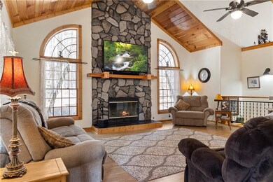 Stone fireplace and many windows